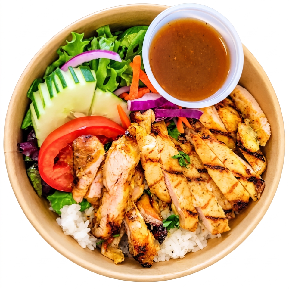 Grilled chicken and vegetables served over white rice and greens, with cucumber, tomato, onions, carrots, and dressing.
